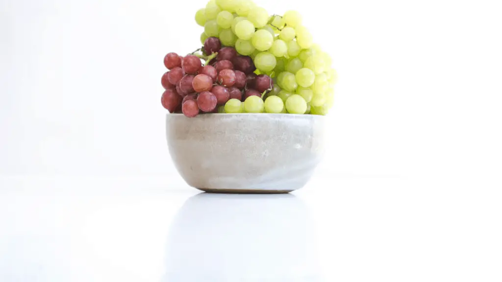 bowl of red and green grapes